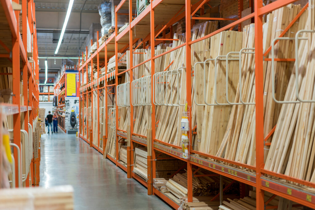 Interior Of Hardware Retailer With Aisles, Shelves, Racks Of Building Material Insulation Floor To Ceiling.